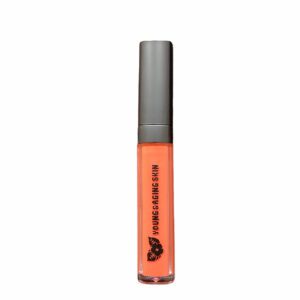 A container of corrective liquid concealer in an orange shade