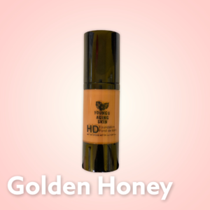 A container of a liquid foundation in Golden Honey shade