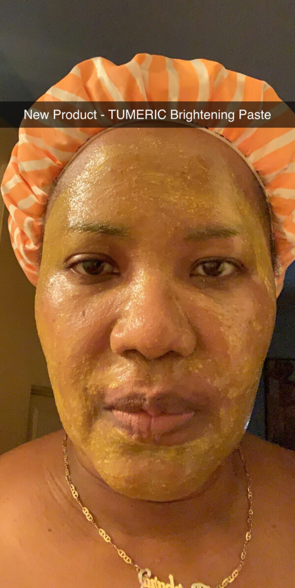 Application of turmeric brightening pack on face